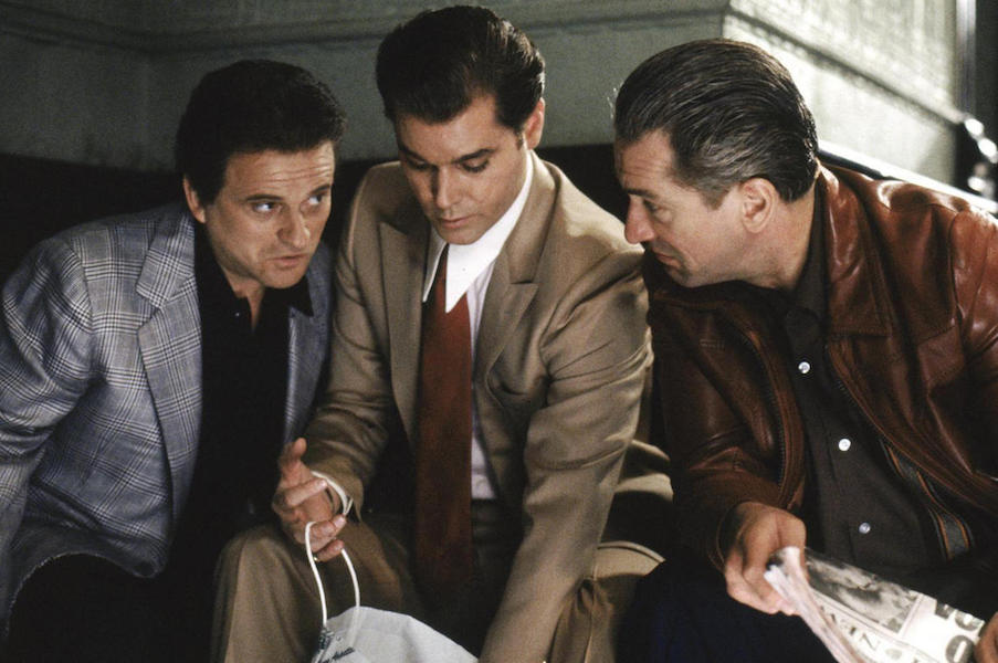 Joe Pesci, Ray Liotta and Robert De Niro embody the style of the time with generous drape cut suits, structured shoulders, wide ties and slicked back hair. De Niro is thought to have had a matching watch and signet ring combination for every outfit.