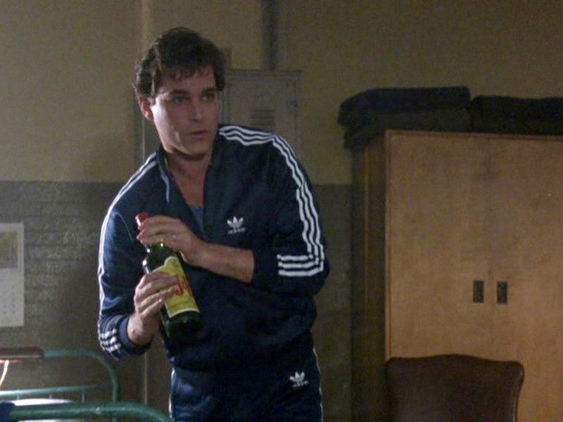 Even in jail, Hill and his associates manage to maintain a level of style. While the older gentlemen don silk jacquard bathrobes and smoke cigars, Henry Hill’s Adidas tracksuit signify his younger, more energetic and street-savvy approach.