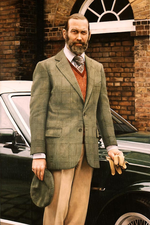 Wearing a single-breasted tweed jacket with a matching shooting cap, silk tie and leather driving gloves, Prince Michael of Kent requested to be depicted wearing what he calls his ‘driving outfit’, and liked the idea of including his cherished sports car, in a portrait by Richard Stone, 1990.