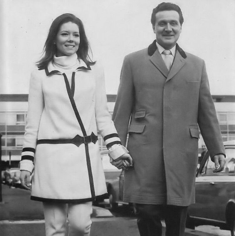 Macnee and actress Diana Rigg are the epitome of 60s style while travelling to America in order to promote The Avengers, 1966.