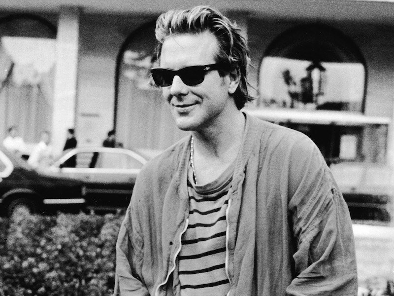 In a casual attire of t-shirt and sunglasses whilst attending the Cannes Film Festival to promote his film Homeboy, 1988. Photo by RDA/Getty Images.