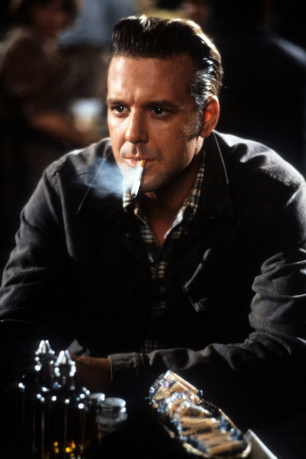 Mickey Rourke smokes in a scene from the film Johnny Handsome, 1988. Photo by TriStar/Getty Images.