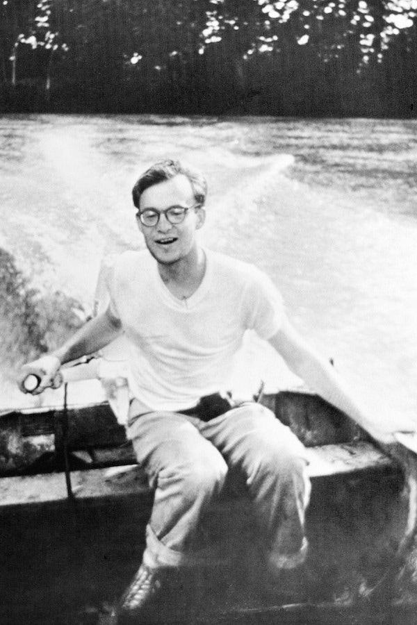 Michael Clark Rockefeller, son of Governor Nelson Rockefeller, driving a boat aged 22, a year before his tragic disappearance during a mission to find primitive art in Dutch New Guinea in 1961.