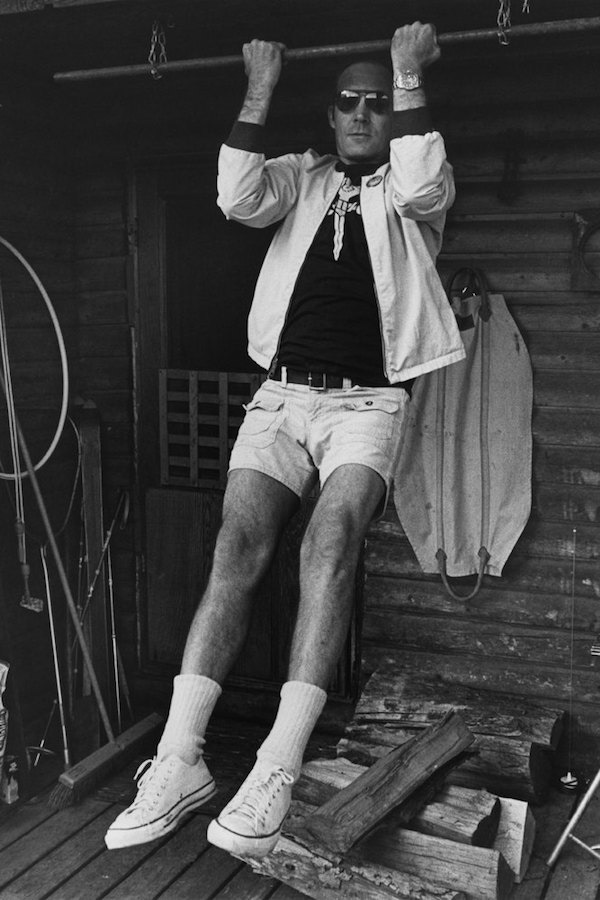 Journalist Hunter S. Thompson sports Converse All Stars low-tops whilst doing pull ups at his ranch near Aspen, Colorado, circa 1976. Photo by Michael Ochs Archives/GettyImages.