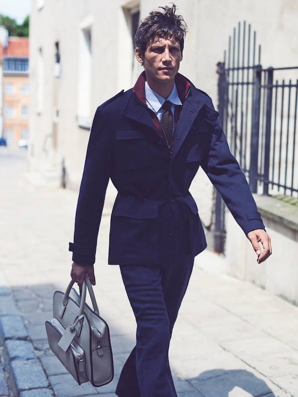 Blue wool field jacket, Canali; burgundy zip sports jumper, Lanvin; indigo selvedge-denim jeans, Berluti; blue micro-check cotton shirt, Helbers; brown silk knitted tie, Drake’s; cream leather Private bag, Giorgio Armani.