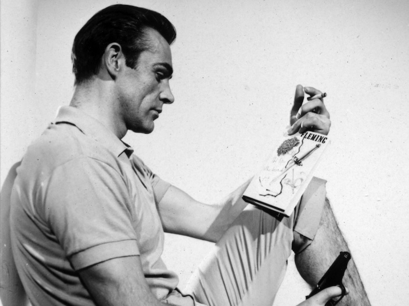 Sean Connery reads 'The Spy Who Loved Me' on set, 1962.