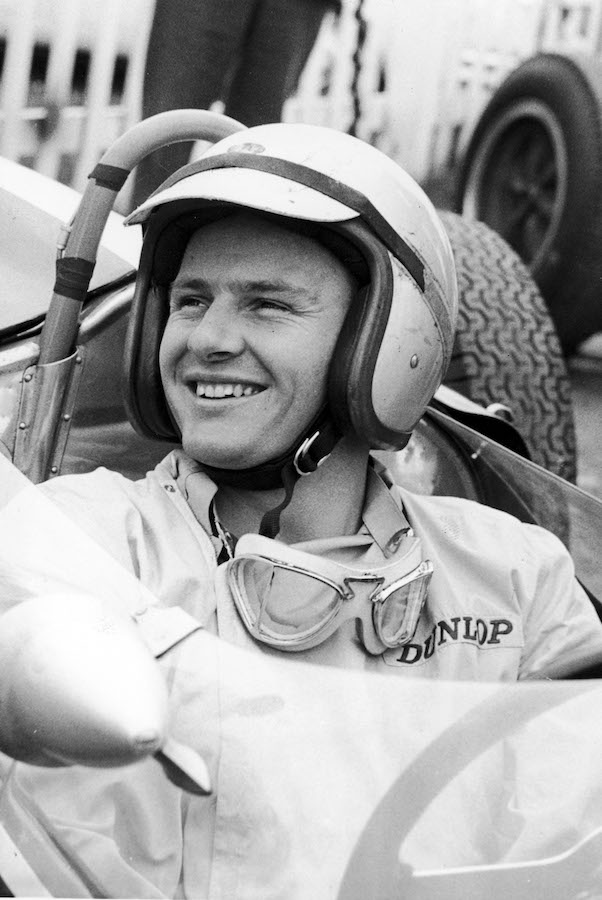 A grin from McLaren at the 1965 Formula One Grand Prix, driving for the Cooper Car Company.