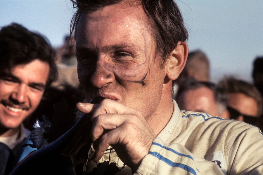 Celebrating his victory at the Can-Am round in Riverside, California in 1967. (Photograph by Bernard Cahier).