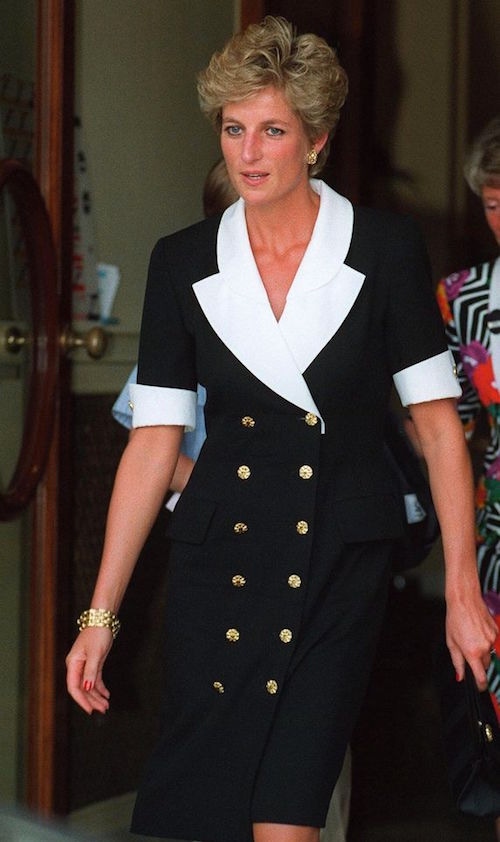 The Princess of Wales in a black suit dress with contrasting white lapels and cuffs at Wimbledon, 1994.