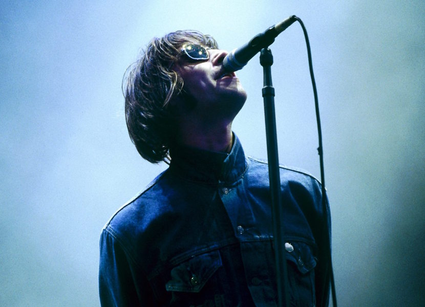 Performing on stage, 1996. Photo by Marc Marnie/Redferns.