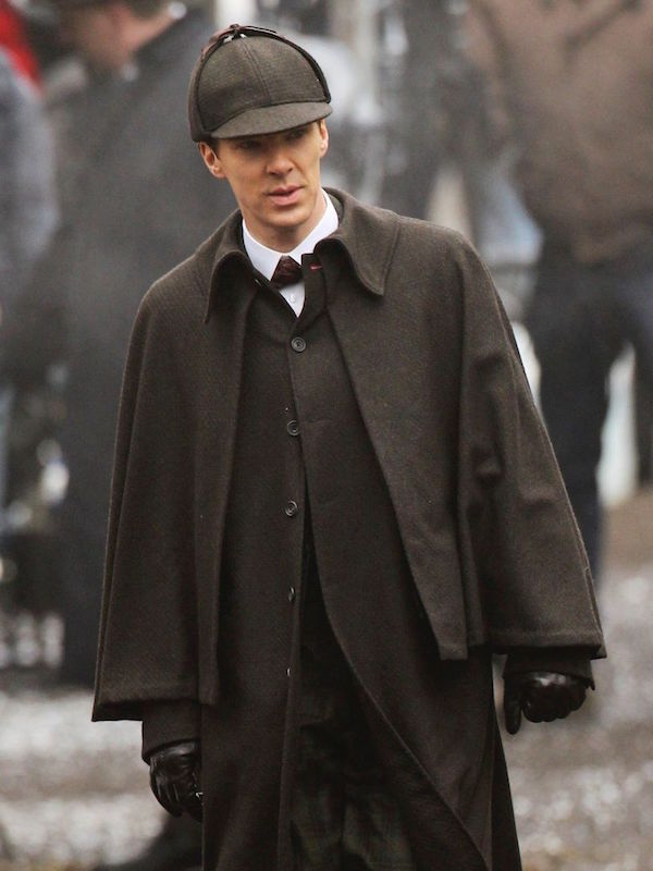 Cumberbatch in period dress - including a cape and deerstalker hat - filming an episode of Sherlock set in Victorian London.