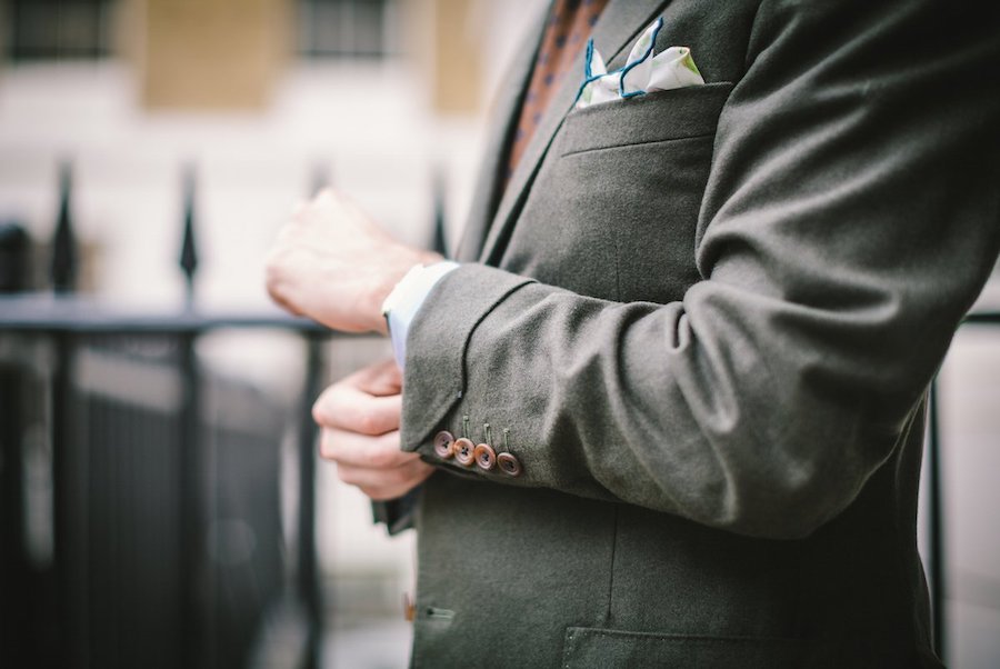 Simon Crompton demonstrates how to wear a gauntlet cuff with four buttons on the sleeve, here rendered in a bespoke green flannel suit by Anderson & Sheppard-trained tailor Brian Smith.