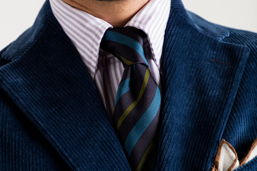 Navy cotton corduroy single-breasted jacket, lilac Bengal stripe Oxford cloth shirt and navy, teal and olive reppe stripe tie, Drake’s for The Rake.