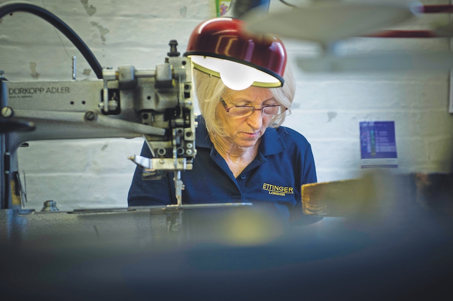 One of Ettinger's many skilled craftspeople working on a bespoke item.