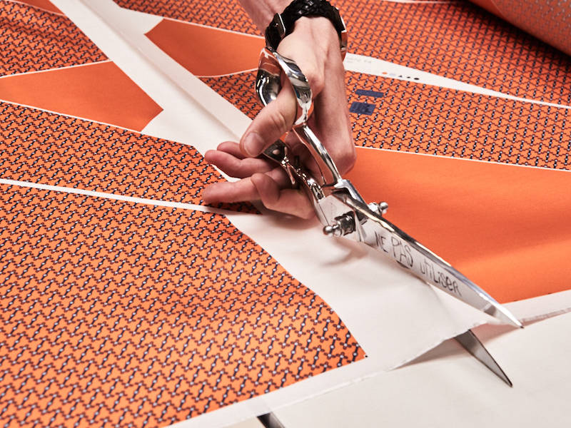 Cutting tie patterns in the finishing room. Photograph by Kim Lang.