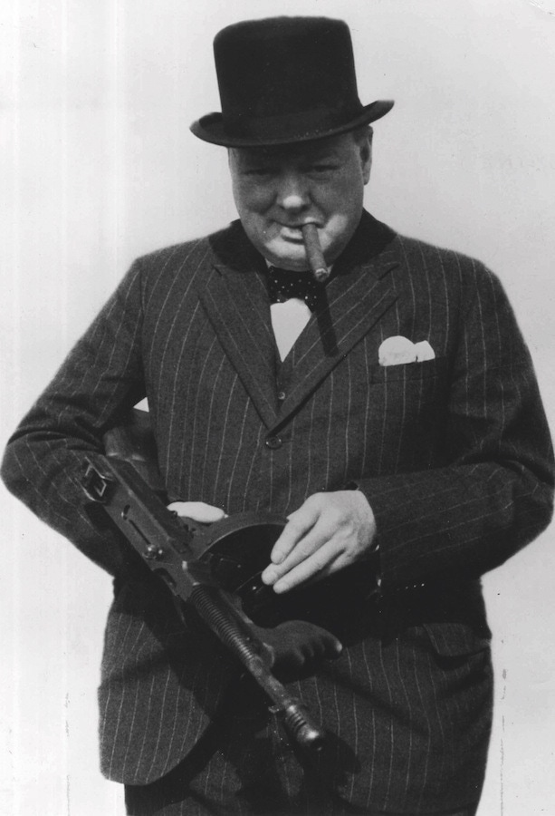 Sporting a chalkstripe suit by Henry Poole while inspecting invasion defences near Hartlepool in 1940. This photograph later became a propaganda tool used by both sides.