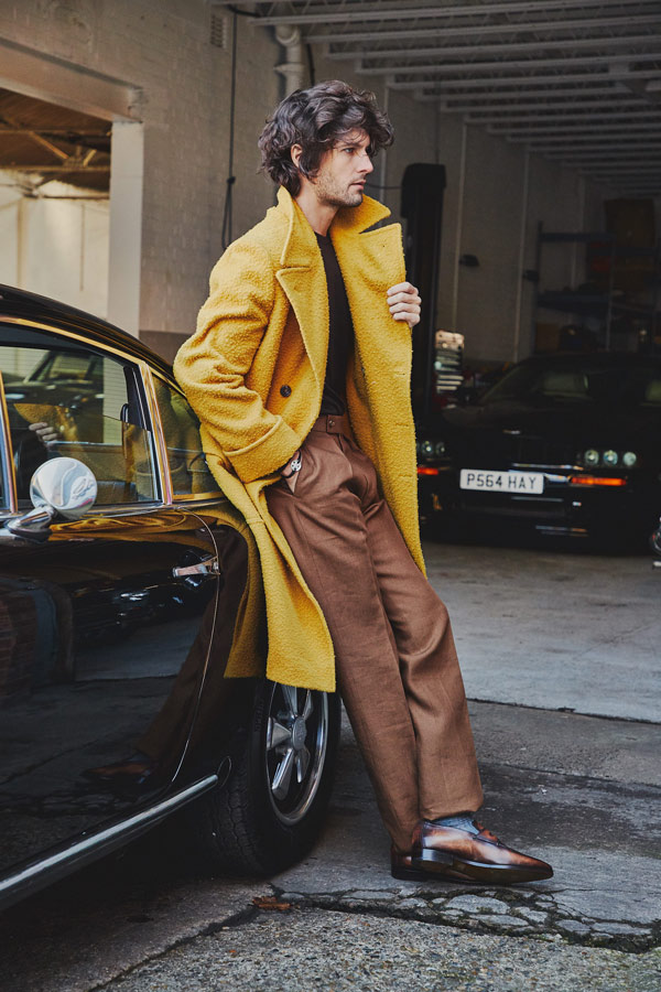 Mustard wool Casentino ulster coat, Rubinacci; Brown cashmere tobacco pleated front linen trousers, Huntsman; Chocolate crew neck cashmere sweater, Anderson & Sheppard; Grey merino wool socks, Pantherella; Brown Andy Démesure leather loafer, Berluti.