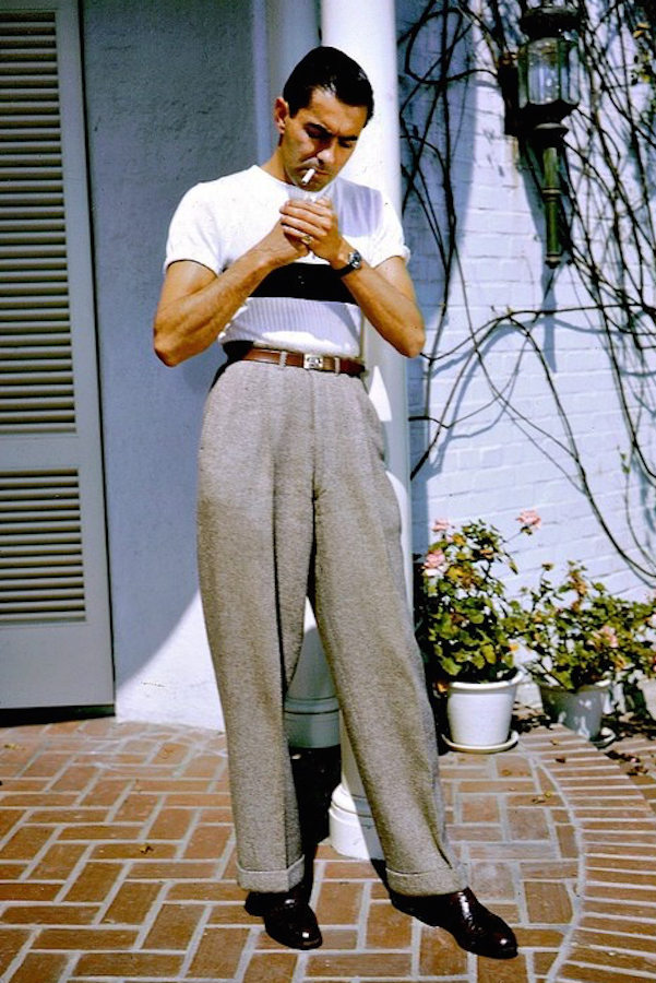 Tyrone Power playing with silhouettes in the 1940s. His slim-fitting knitted top is countered with billowing, wide-legged trousers with chunky turn-ups.