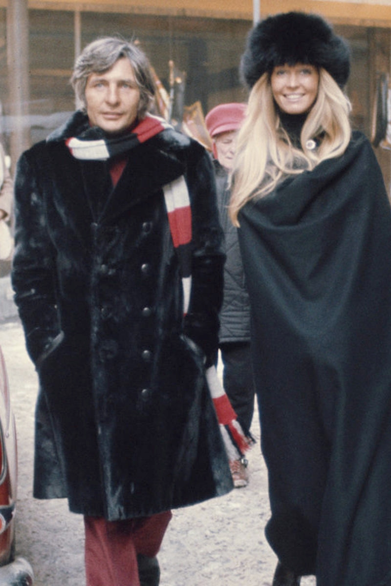 German film maker, photographer and socialite, Gunter Sachs (1932-2011) pictured with his wife, Swedish model Mirja Larsson as they walk down a snow covered street in St Moritz, Switzerland on 22nd February 1971. (Photo by Rolls Press/Popperfoto via Getty Images/Getty Images)