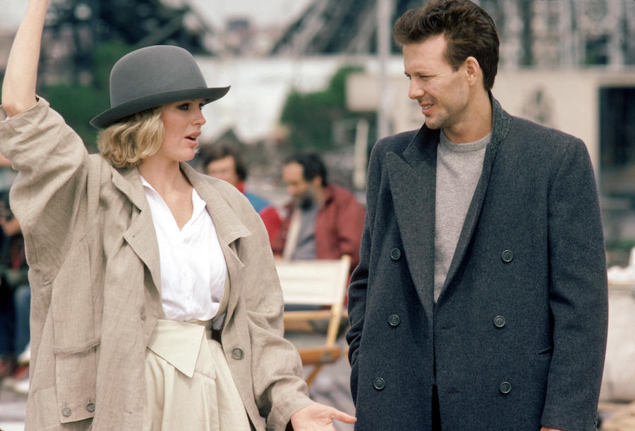 Mickey Rourke demonstrates a less formal way to wear a DB overcoat by layering it over a tonal knit. Here, he's shot with Kim Basinger in Nine ½ Weeks, 1986. Photograph by AF archive/Alamy.