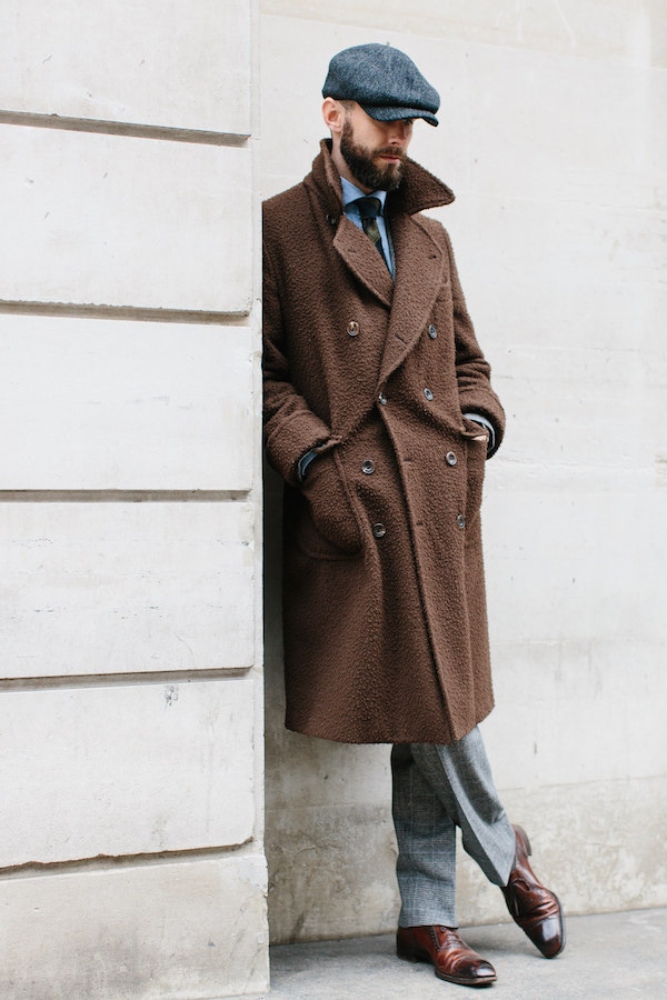 Simon Crompton represents excellent taste in both British style and Italian tailoring, with a peaked cap and Casentino Ulster Coat by Rubinacci. Photo by Jamie Ferguson.