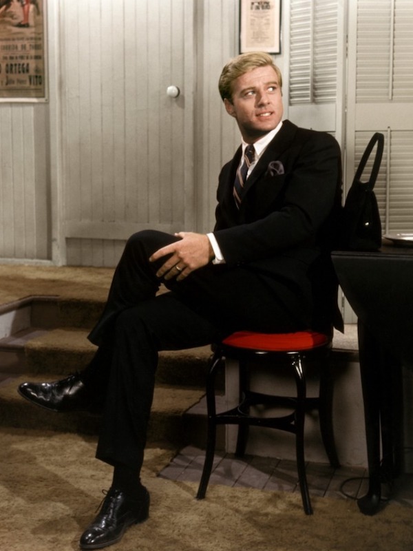 Robert Redford wears a black suit, white shirt and black Oxfords in Barefoot In The Park, 1967.