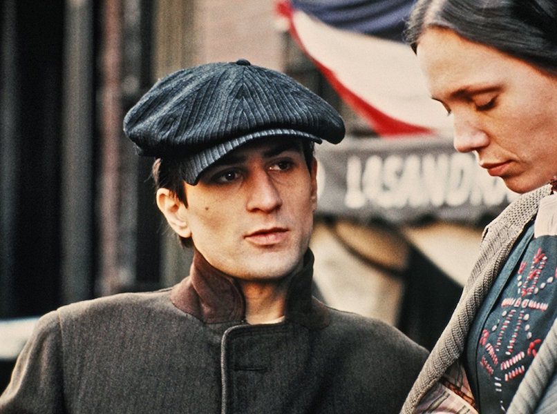 Robert De Niro's ensemble has subtle stripes throughout, from his cap to his coat in The Godfather Part II, 1974.