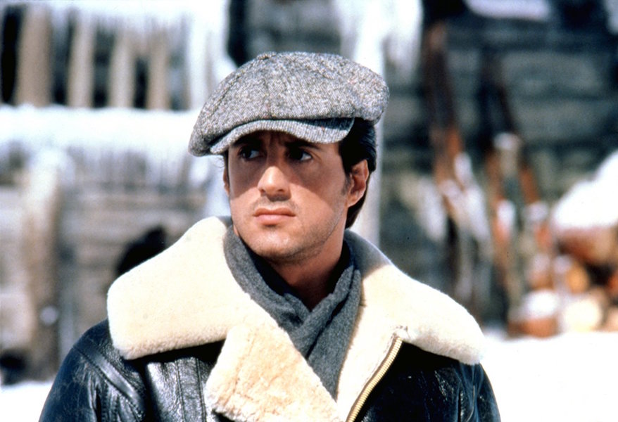 Sylvester Stallone tackles the elements in Rocky IV, in a hefty shearling coat and peaked cap.