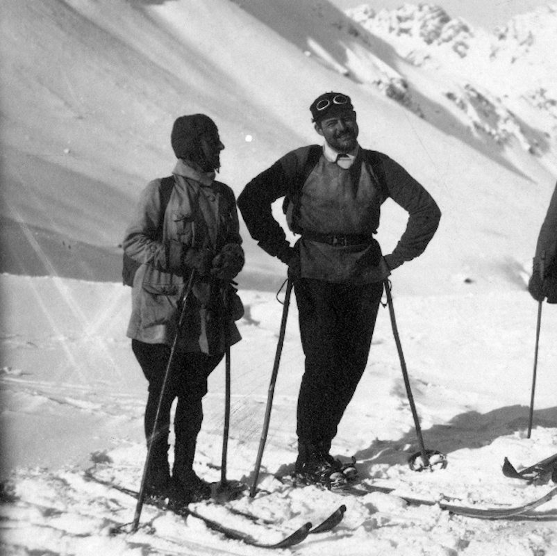 Ernest Hemingway wears a loosely fitted ski-jacket with a collared shirt for a ski trip with friends in Shruns, Austria, 1926.