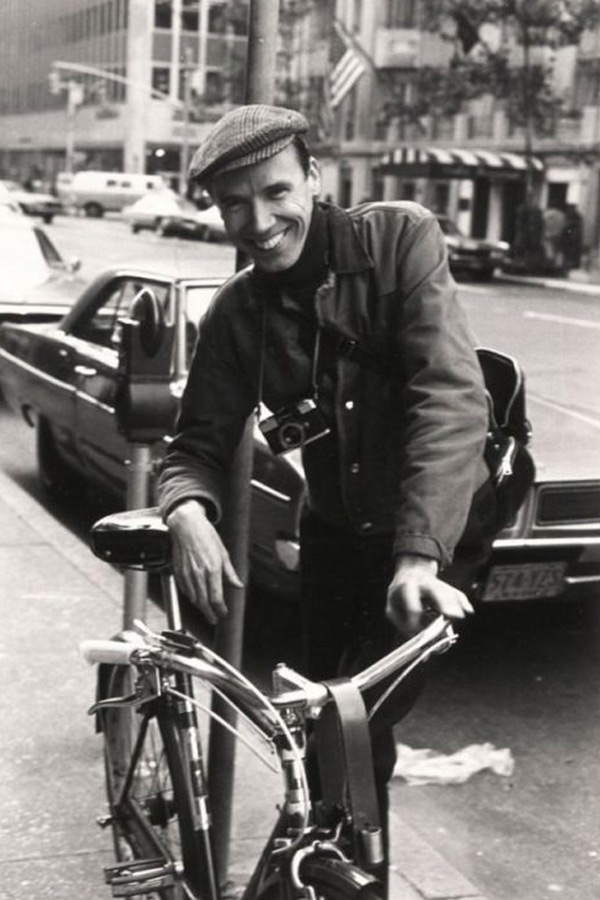 A young Bill Cunningham in a chore jacket and baker boy hat.