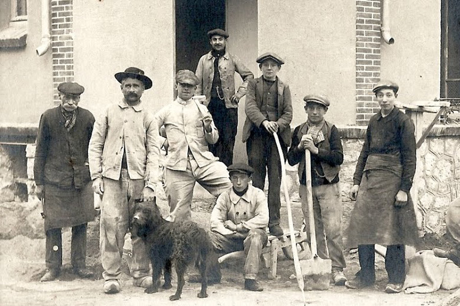 Labourers in well-worn and faded chore jackets.