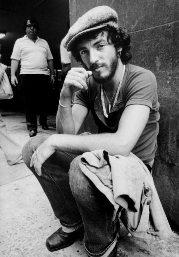 Bruce Springsteen brings a little rock and roll to the usually countrified associations of the peaked cap. Shot by Barbara Pyle circa 1974.