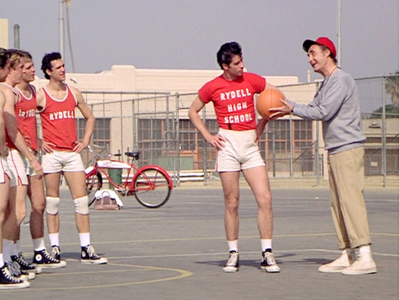 Plain is best, but you can get away with a T-shirt sporting a favourite old alma mater, like Danny Zuko's in Grease, 1978.