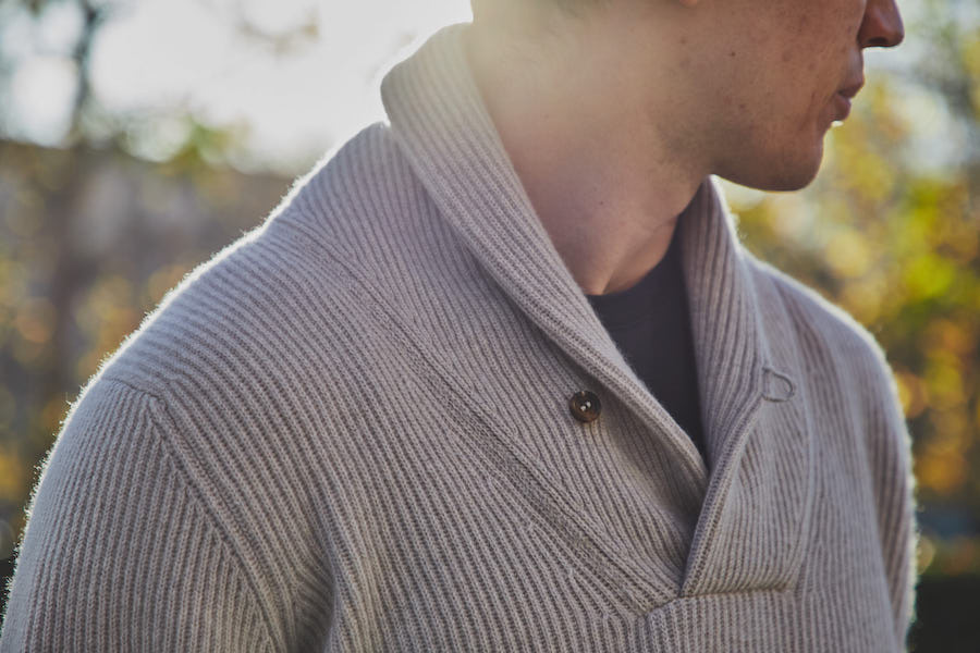 Wear the shawl collar jumper in stone with a dark blue T-shirt for an understated weekend look. Photograph by James Munro.