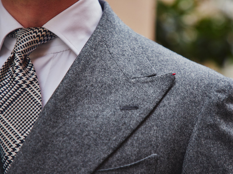 The double-breasted suit is cut with peaked lapels with a hand-sewn button hole. Photograph by James Munro.