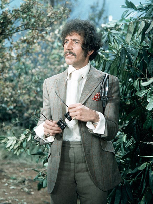 Note the flamboyantly turned-back cuffs outside of his jacket sleeve, oversized tie and tonal separates. Department S, 1969. Photo by ITV/REX/Shutterstock.