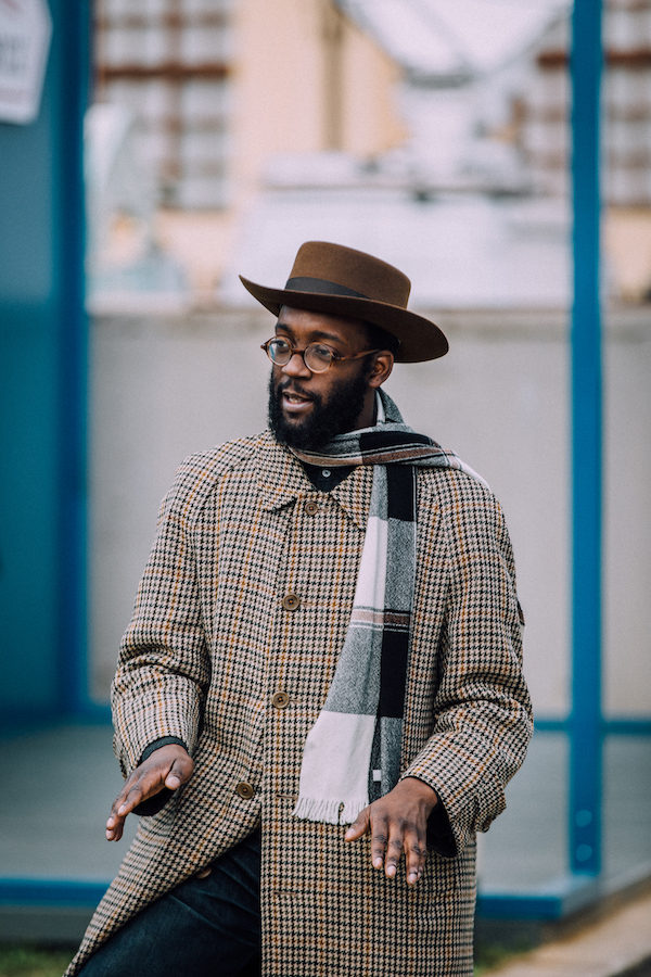 Jonathan from Laird Hatters in a micro-check tweed overcoat.