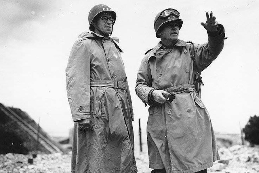 Lieutenant General Omar Bradley (left) and Major General J. Lawton Collins wear military trench coats crafted from waterproof gabardine. Pictured here in Cherbourg, France 1944.