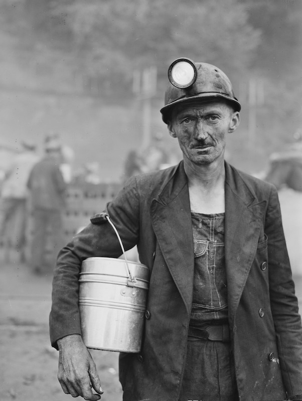 A coal miner from the Inland Steel Company wears a double-breasted unstructured jacket and denim dungarees, Kentucky, USA, 1946.