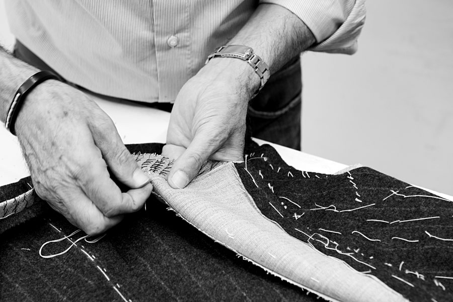 Luigi Dalcuore hand-stitching in his Naples workroom.