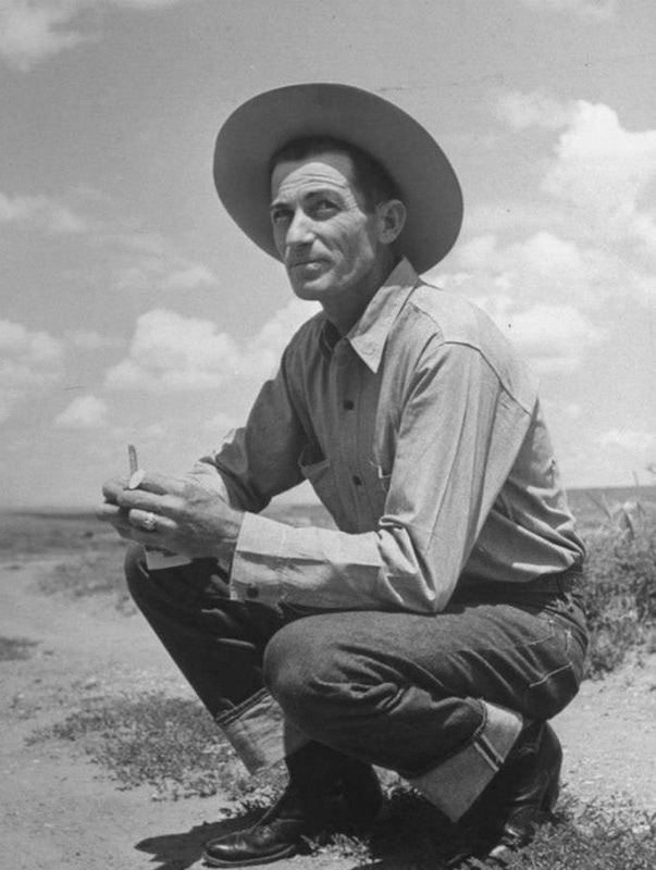 Wearing the cowboy’s uniform of selvedge denim jeans and a sturdy cotton shirt complete with cigarettes in hand, circa 1950s.