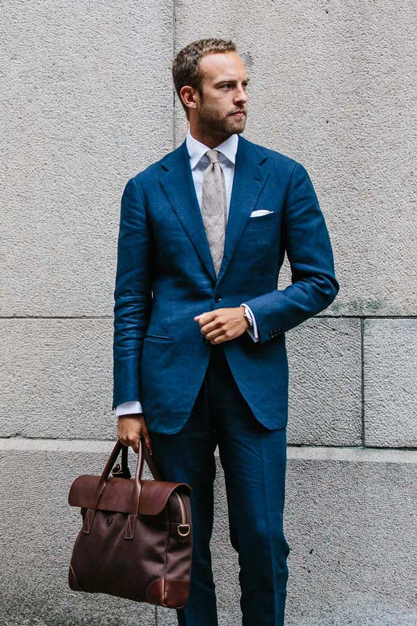 Andreas Weinas fuses classic with modern - while the suit and briefcase is formal, the fabric of both is modern and softens the look. Photo by Jamie Ferguson.