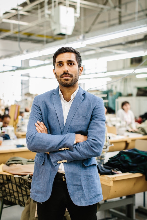 Mo Azam, Managing Director of Grenfell, on the factory floor in east London. Photo by Jamie Ferguson.