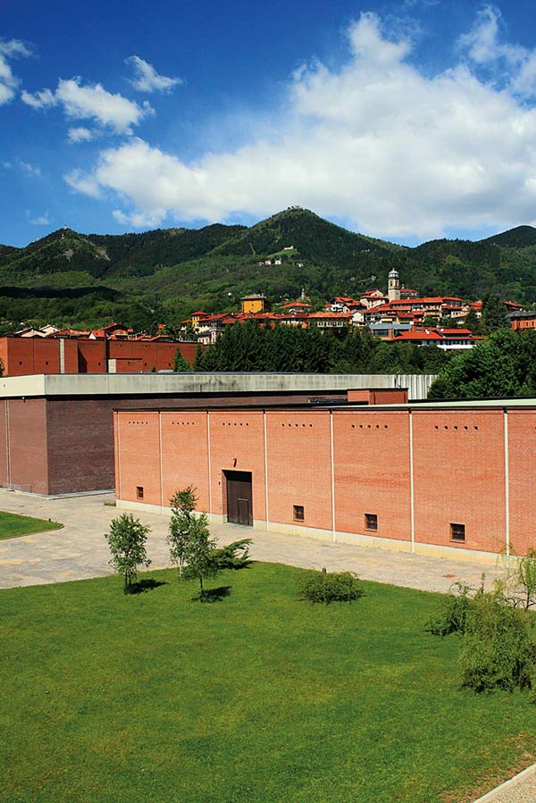 The mill surrounded by Biella’s verdant hills. Photograph by Luke Carby.