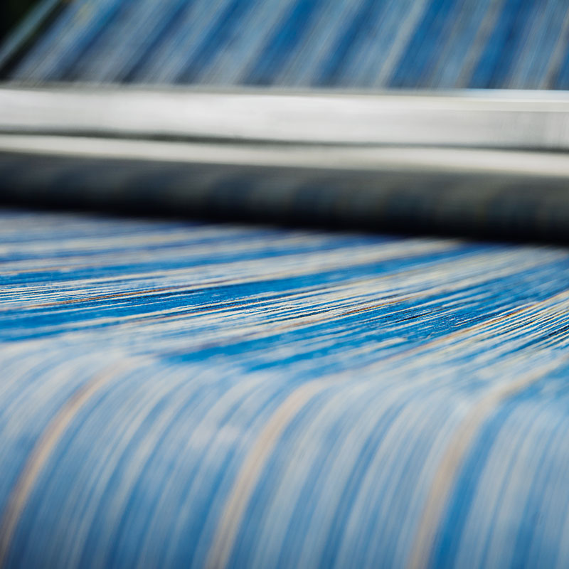 Yarns on the warping beam. Photograph by Luke Carby.