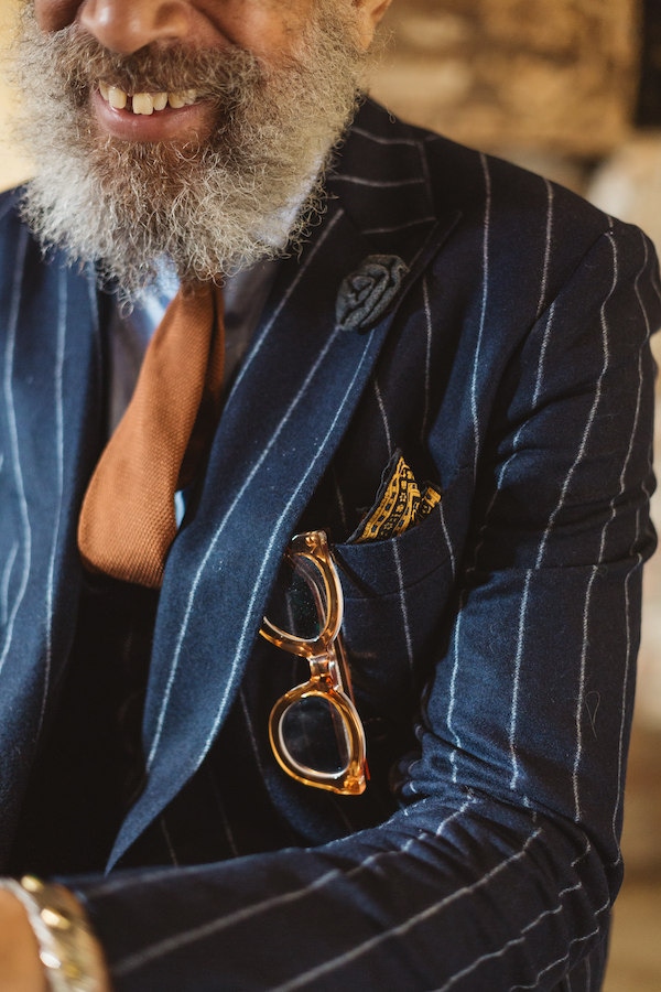 A truly traditional touch no doubt inspired by his love of classic movies, Quiles chooses a subtle woven grey boutonniere by Atelier des Graves for his lapel.