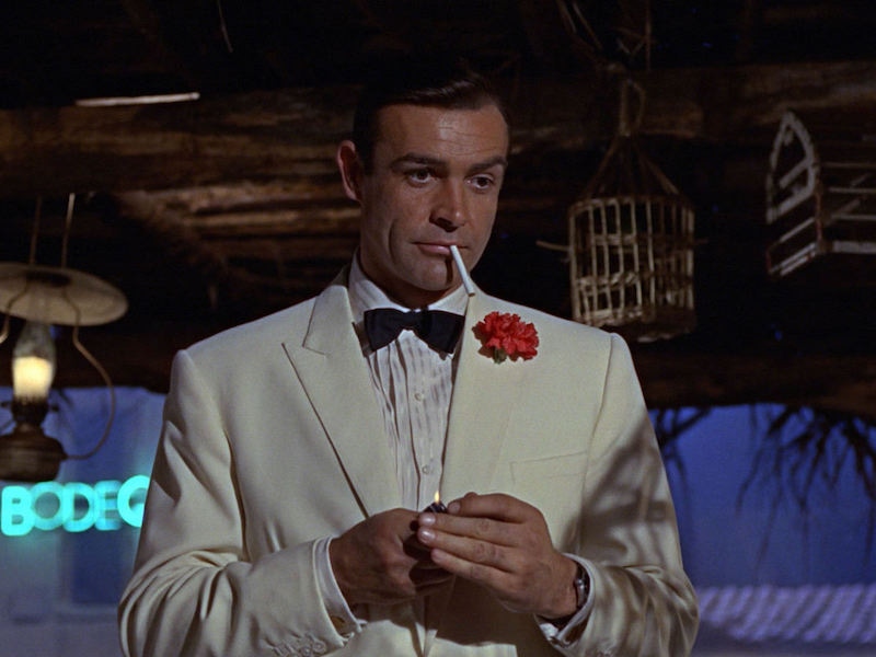 Connery sports a cream dinner jacket, pleat-front shirt and bow tie.