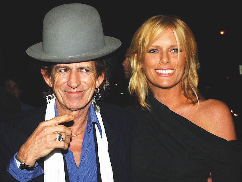 Even aged 75, Richards displays a quirky style wearing an oversized bowler hat with a generous dashing of silver jewelry. Pictured here with his wife Patti Hansen in New York, 2003. Photograph by REX/Shutterstock.