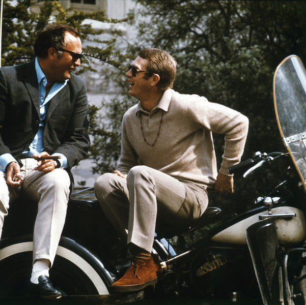 Steve McQueen pairs tones of ecru and beige, finished with tan suede Sanders & Sanders’ chukka boots on the set of Bullitt, 1968.