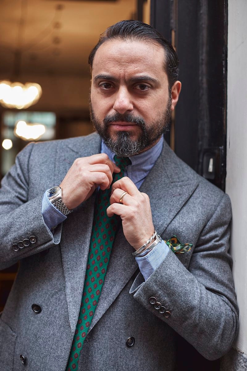 Salvatore adjusts his 40-year-old vintage printed silk tie that was given to him by Luigi Solito.